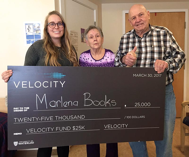 Rachel Thompson and her grandparents hold a giant cheque worth $25,000 from the Spring 2017 UW Velocity Fund competition.
